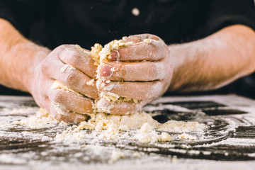 Hands kneading a dough