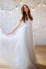 Fototapeta premium Bride in a tender light blue wedding dress in a morning. Fashion beauty portrait