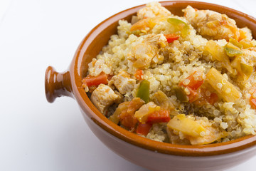 High-key image of white plate with quinoa lentil salad and bowl