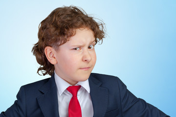 Closeup up portrait of s suspicious, cautious child boy