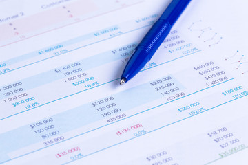 Business performance graph with ballpoint pen