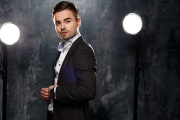 Close-up portrait of handsome elegant young man in a suit
