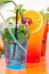 Cold cocktail with slices of fruit