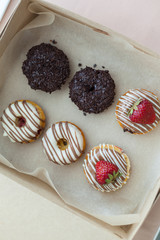 Colorful donuts in box