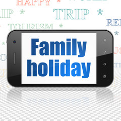 Vacation concept: Smartphone with Family Holiday on display