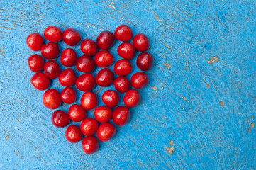 Heart shaped cherries on blue background cherry heart