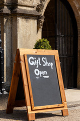 NEWSTEAD ABBEY, JUNE 5:  A chalk board A-sign stating Gift Shop Open. At Newstead Abbey, Nottinghamshire, England. On 5th June 2016.