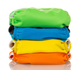 Stack environmentally friendly diapers isolated on white.