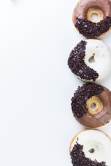 various donuts on white background