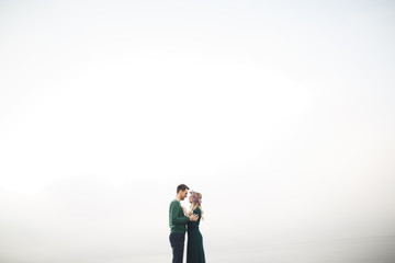 Happy couple on the pier, young family in love spending honeymoon vacation luxury islands