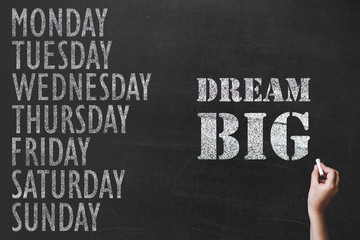 written message 7 day of week on chalk board background and sport motivation text