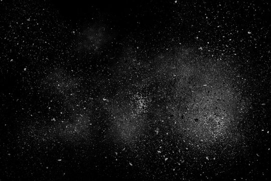 White abstract powder explosion on a black background