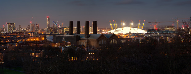 London, UK - JANUARY 7, 2016: Panorama of Canary Wharf in night. View includes the park, National...