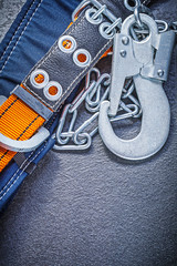 Construction harness with metal chain on black background mainte