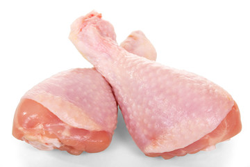Raw chicken legs close up isolated on white.