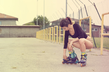 Young woman on rollerblades