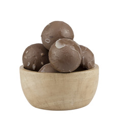 chocolate balls in wooden cup.