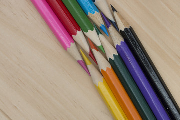Obraz premium pencils color on wood table.