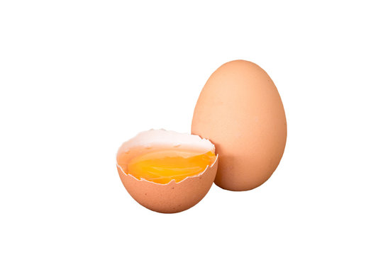 Fresh farm eggs. A egg yolk in cracked egg shell.