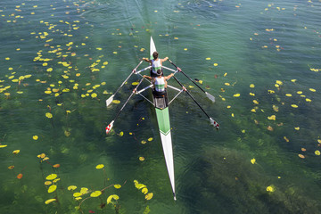 Two rowers  rowing