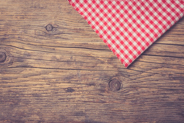 Checkered tablecloth on wooden table