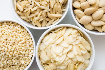 Bowls of whole, flaked, chopped and slivered almonds from above.