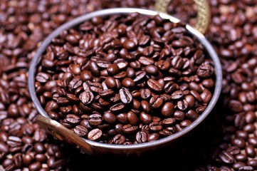 Coffee beans in a copper plate