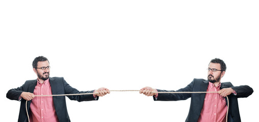 Two businessmen playing tug of war