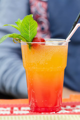 Cold cocktail with slices of fruit