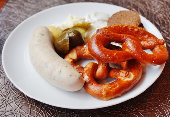 A German breakfast with pretzel and wurst sausage