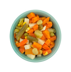 Top view of mixed vegetables in a small bowl isolated on a small background.