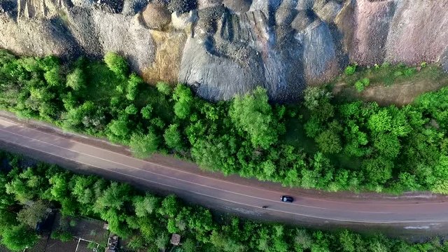 beautiful landscape with road and settlements and plants on sides, aerial shoot, top view