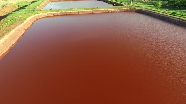 Red lakes in industrial part of Kryvyi Rih, Ukraine, aerial shoot