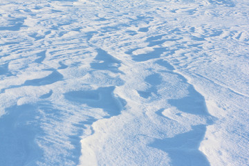 Natural background on a surface of a snow field in the winter