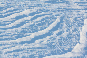 Natural background on a surface of a snow field in the winter