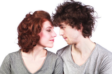 Portrait of a beautiful young couple love romance white background