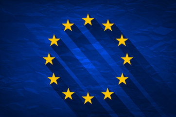 Grunge Flag Of Europe on crumpled paper background. Vintage effect