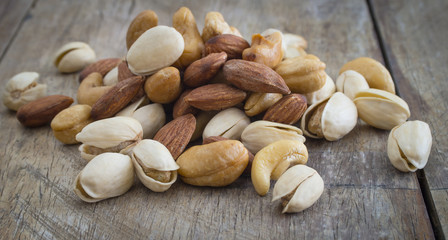 Close up photo of  almond, cashew and pistachios pile