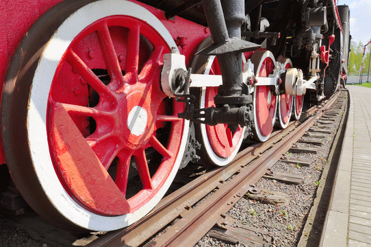 The old iron railway locomotive red wheels.