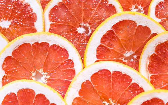 Close up of sliced grapefruit as a background.
