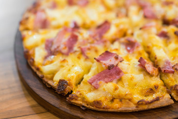 Pizza on wooden background