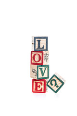 photo of a alphabet blocks spelling LOVE? isolate on white backg