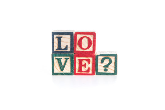 photo of a alphabet blocks spelling LOVE? isolate on white backg