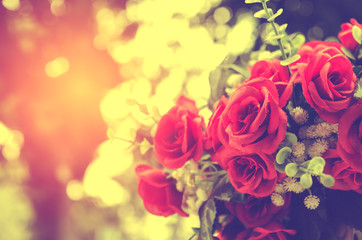 bunch of red rose flower on table with nature blur background