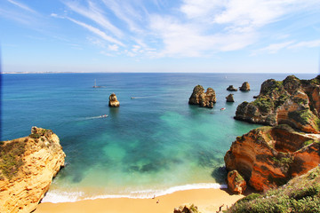 Rocky beach at sunset, Lagos, Portugal. Travel and business background
