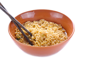 Bowl of instant noodles isolated on white background. Chopsticks