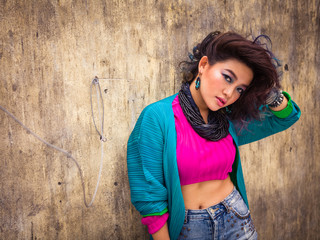 Attractive young Asian girl posing in the middle of the market i