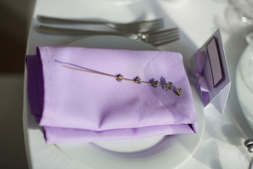Table setting with lavender flowers, close-up