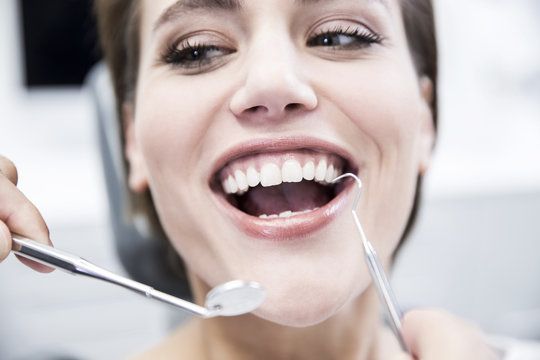 Young woman at the dentist receiving treatment