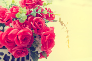 bunch of red rose flower on table with nature blur background